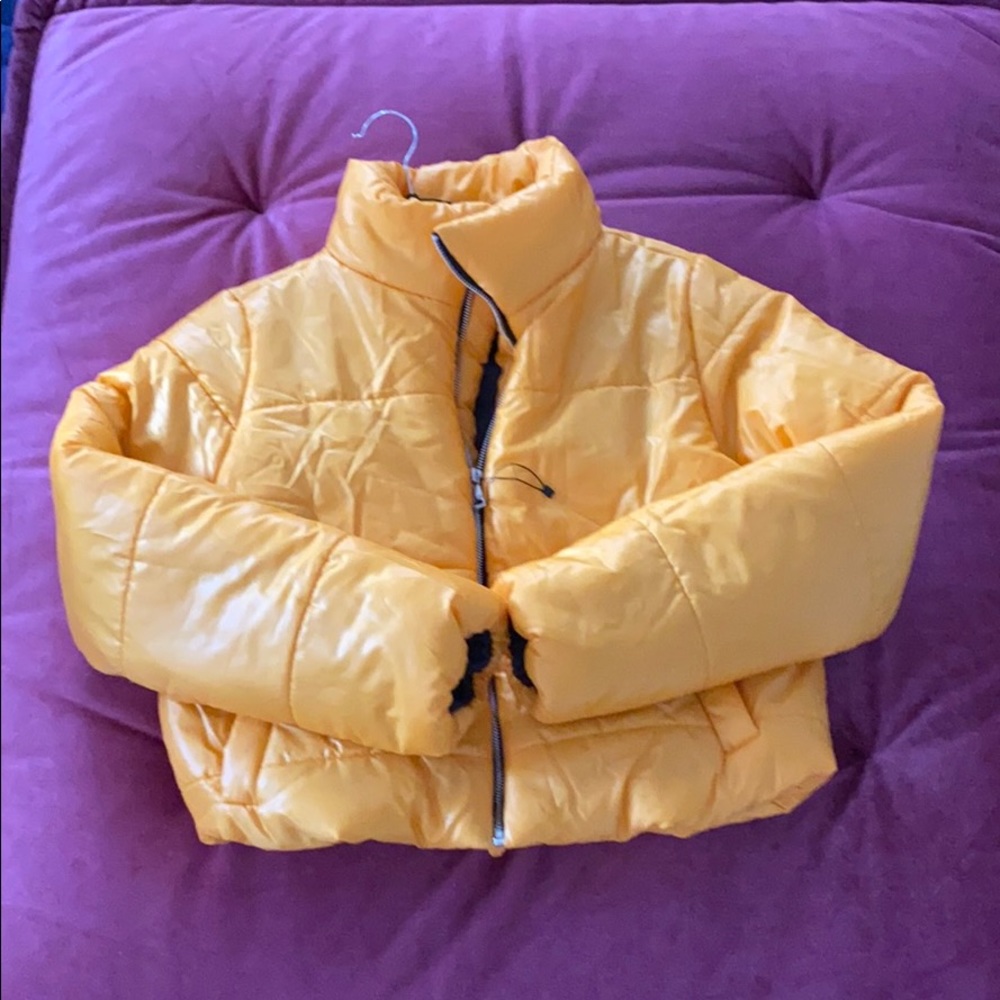 A Small Rising Company Puffer Jacket in Yellow